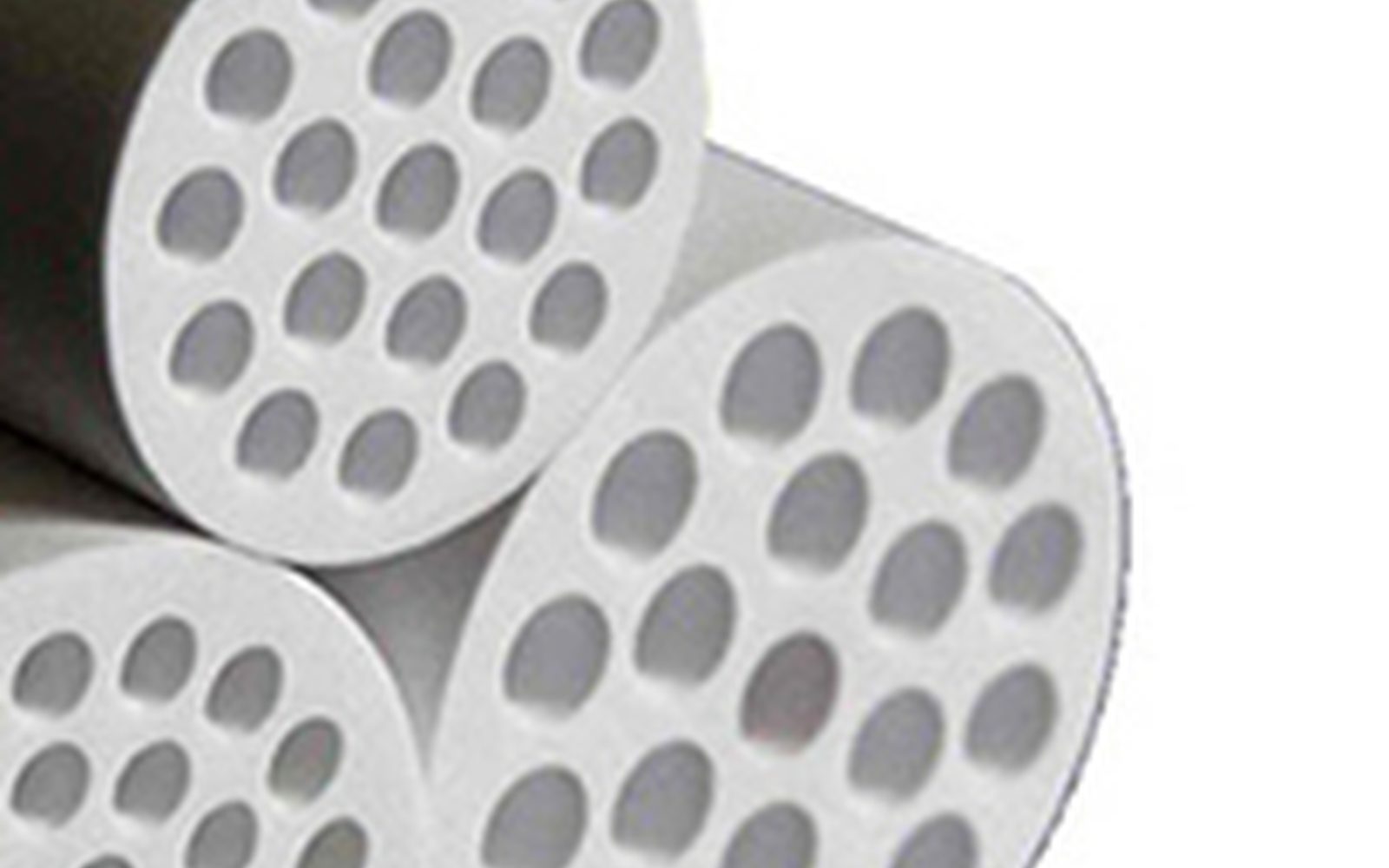 Alumina multi-channel tubular ceramic elements. Ivory sintered channel faces.